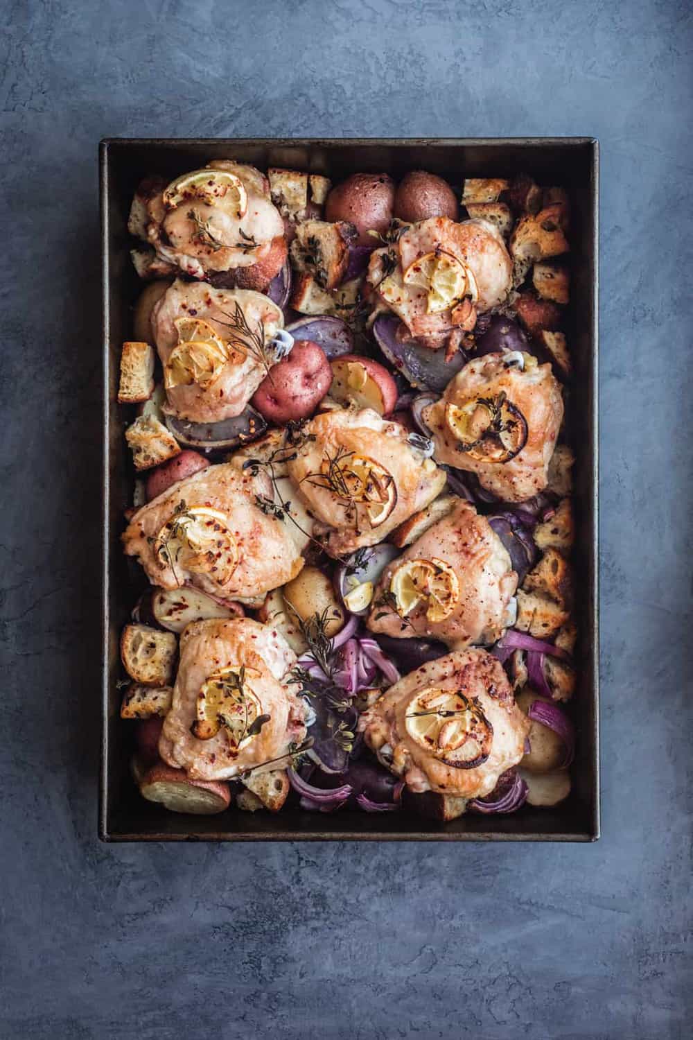 Sheet Pan with Chicken & Potatoes in baking tray, post oven.