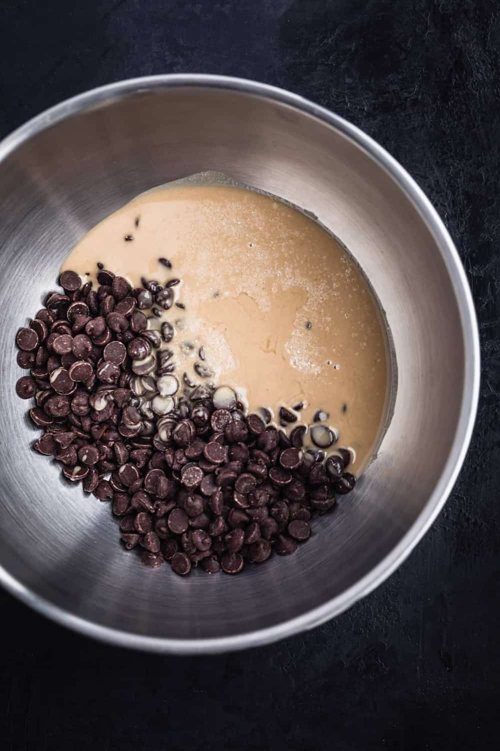 Chocolate chips, salt and tahini in a bowl.