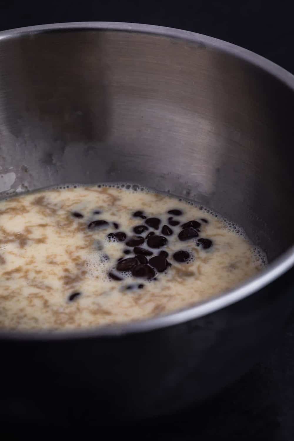 Cream mixture is poured into chocolate tahini bowl.