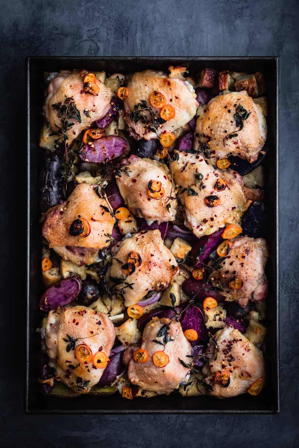 Sheet Pan with Chicken, Potatoes & Kumquats in baking tray, post oven.