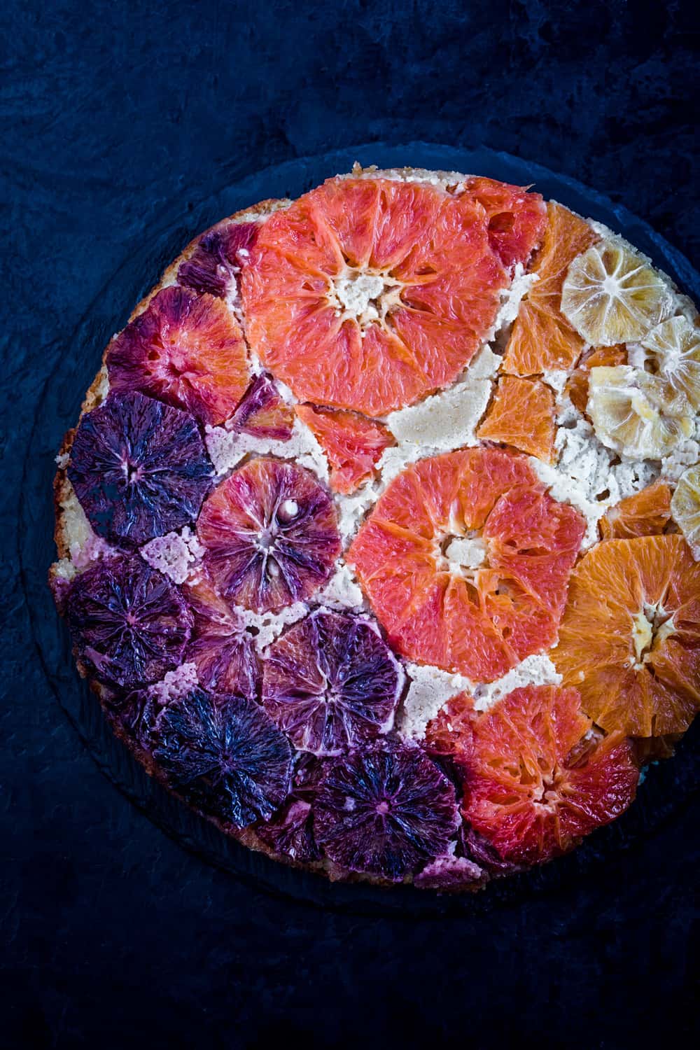 Winter Citrus Upside-Down Cake, all done, made with oranges, grapefruit, blood oranges and lemons, arranged in a rainbow.