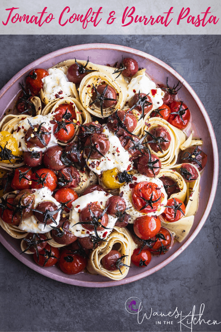 Cherry Tomato Confit and Burrata Pasta on a pink plate, overhead shot.