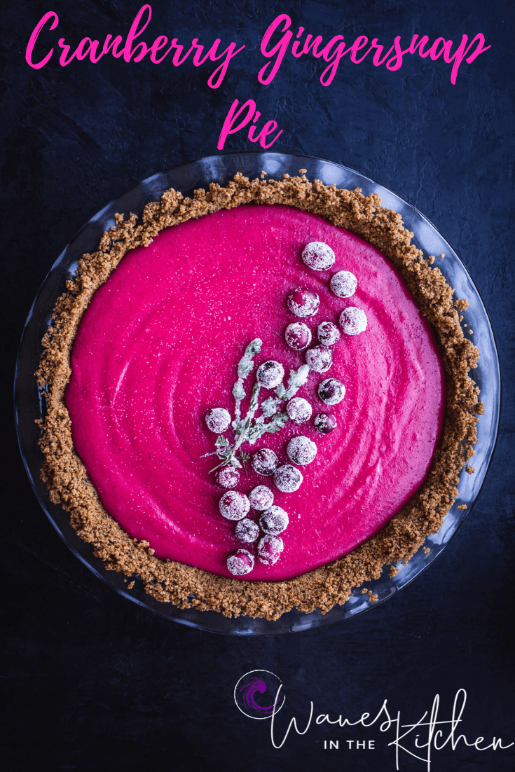 Cranberry Gingersnap Pie. Topped with sugared cranberries and sugared thyme. overhead shot, on a black background, center frame.