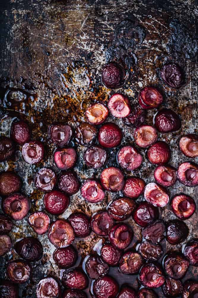 Roasted pitted cherries, on a cookie sheet, straight out of the oven.