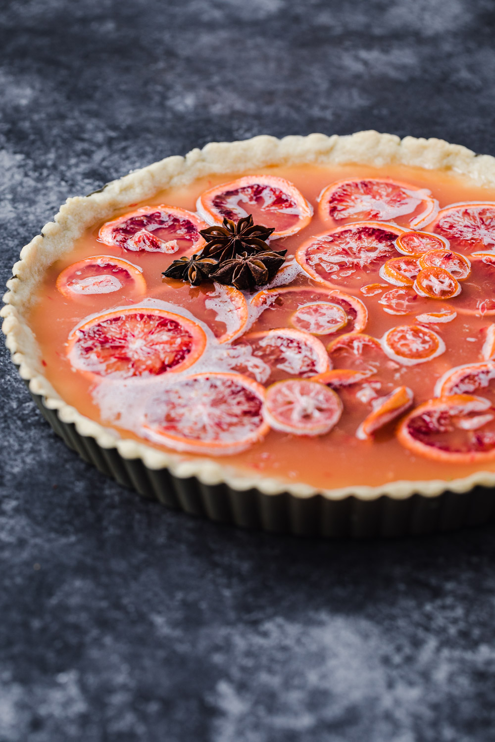 side angle shot of the blood orange and shaker tart with the addition of star anise