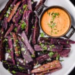 sweet potato fries served on a platter with chipotle aioli