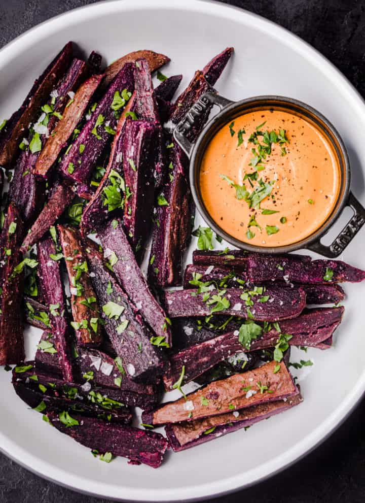 sweet potato fries served on a platter with chipotle aioli