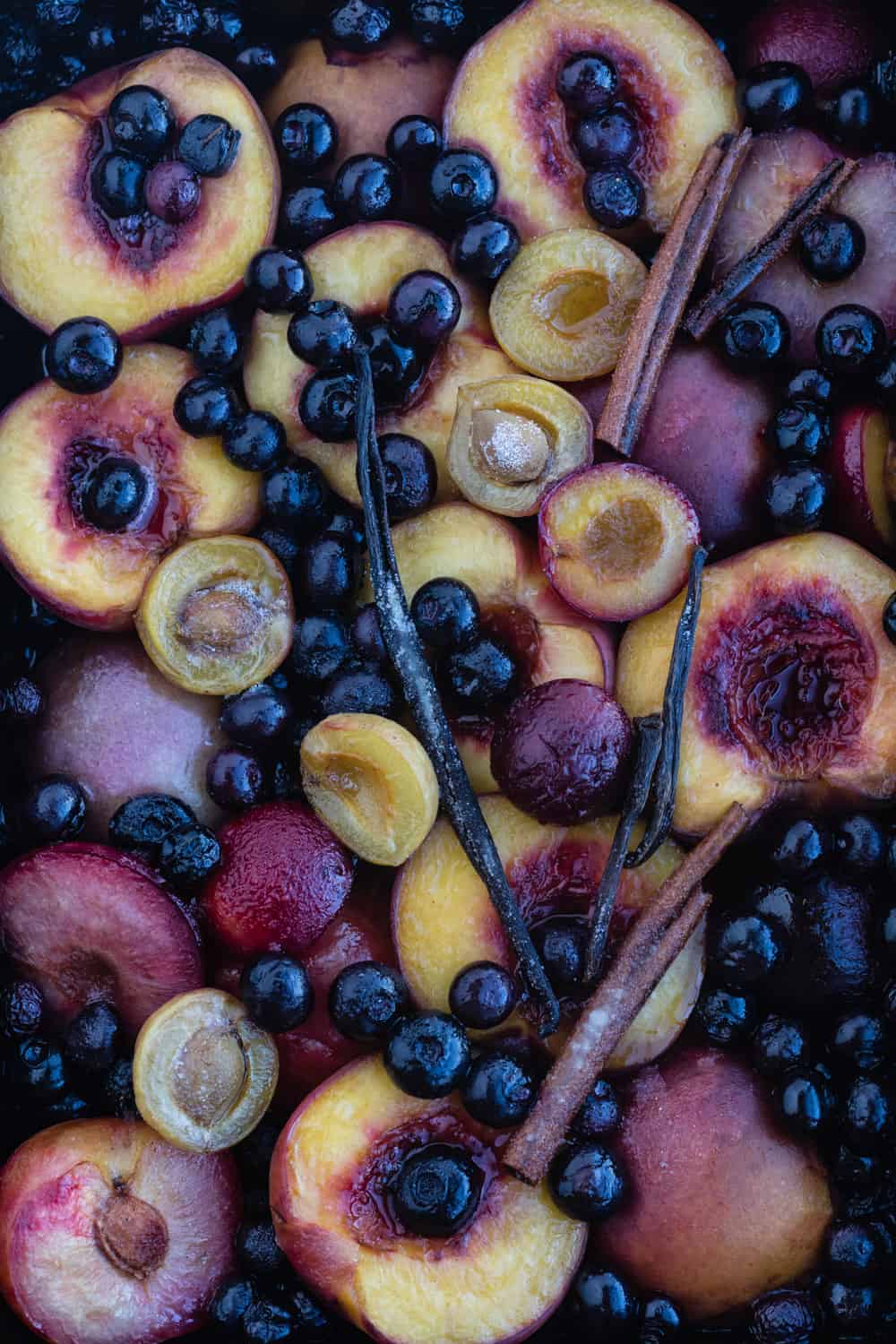 Cooked stone fruit! stone fruit and blueberries just out of the oven, overhead shot.