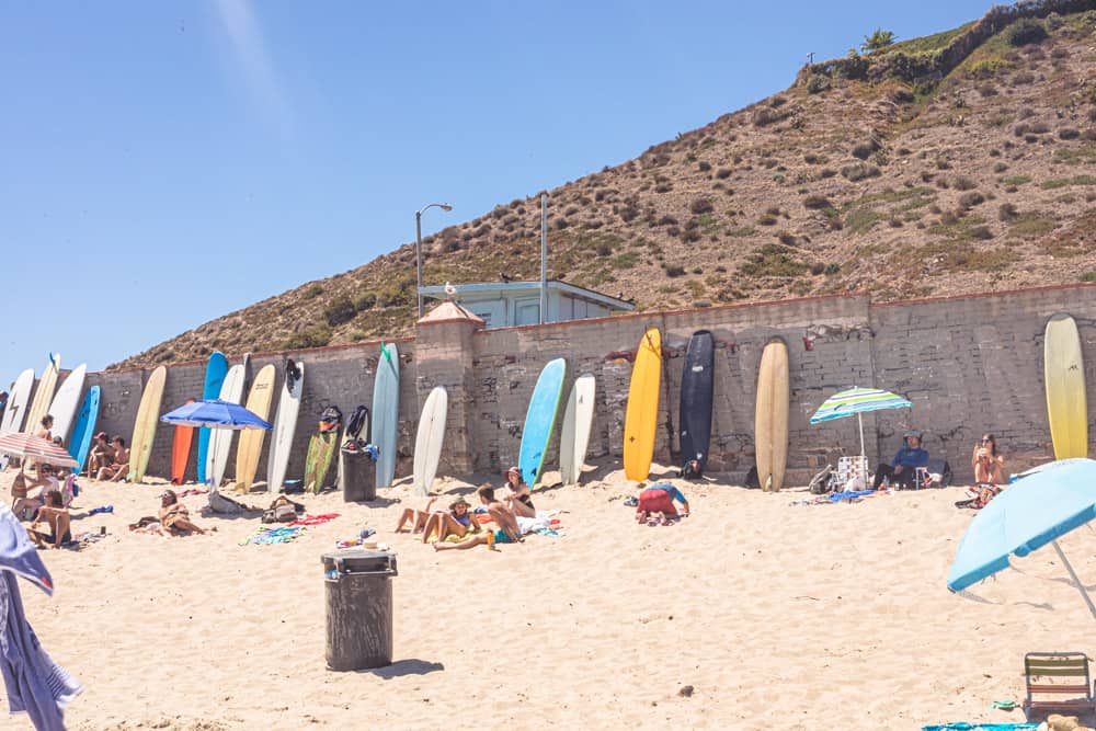 Malibu - Surfrider beach. All the longboards leaning up against the wall.