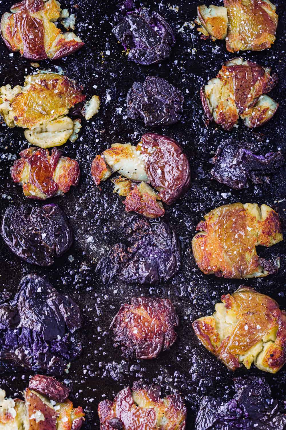 Crispy smashed purple, red and white potatoes, all done and overhead shot.