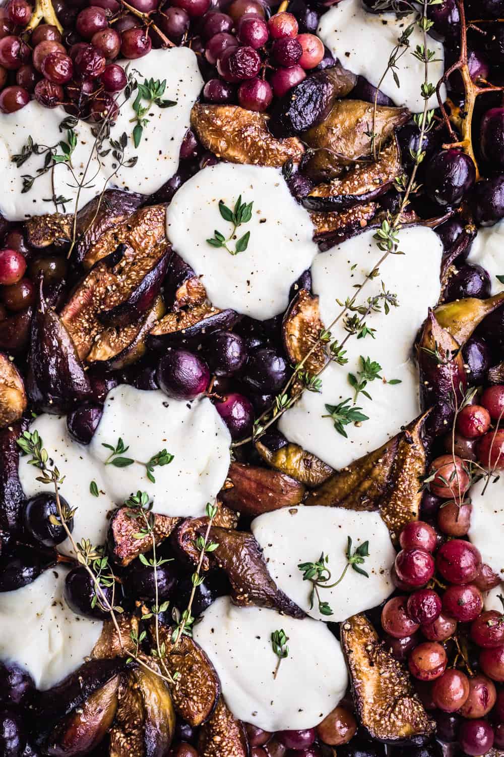 post oven balsamic roasted grape and figs topped with mozzarella and thyme; overhead shot