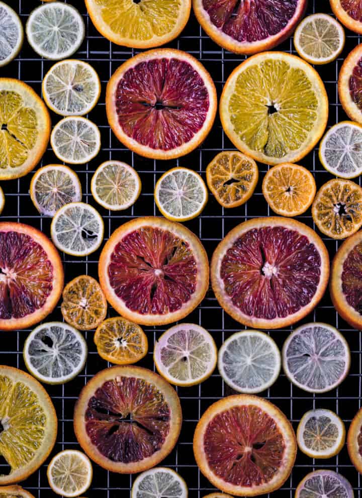 colorful citrus slices drying on a wire rack; overhead
